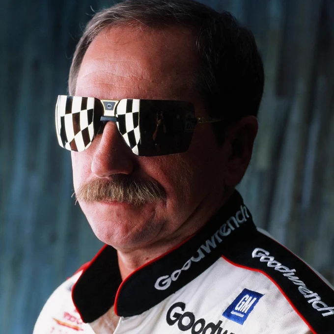 Legendary 7-time NASCAR Cup Series champion Dale Earnhardt in his iconic Gargoyle Sunglasses and GM Goodwrench uniform.