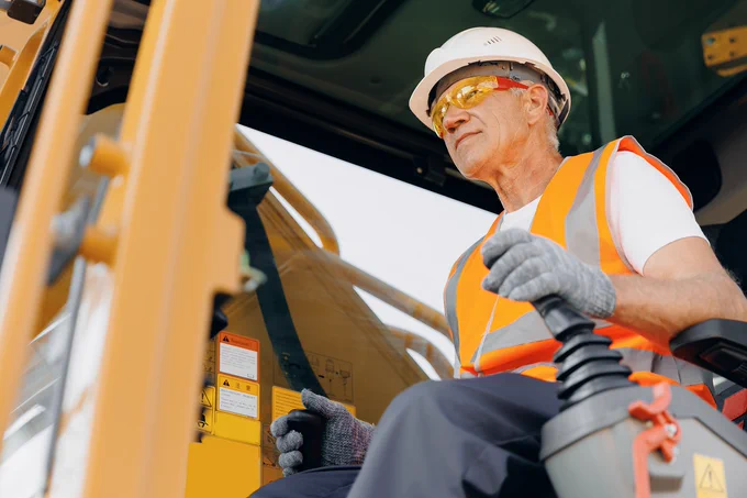 A construction worker operating machinery