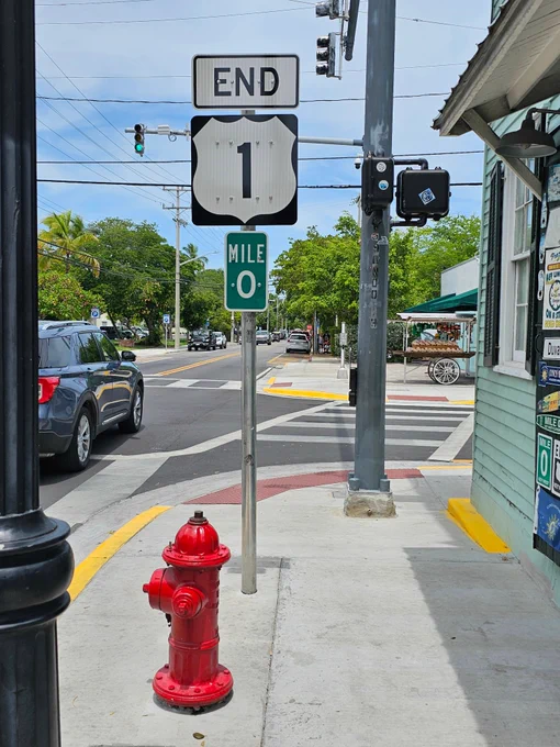 [𝐖𝐡𝐞𝐫𝐞 𝐭𝐡𝐞 𝐑𝐨𝐚𝐝 𝐄𝐧𝐝𝐬, 𝐘𝐨𝐮𝐫 𝐒𝐭𝐨𝐫𝐲 𝐁𝐞𝐠𝐢𝐧𝐬...]

Mile Marker 0.

It's not just a sign.

It's an invitation.

Funny how a marker that says "END" actually means "START HERE" in Key West language.

This is where the pavement runs out...

And possibilities run wild.

Where your GPS has no more suggestions...

And your soul takes over navigation.

Think about it:

• Your Monday morning meeting? Could be with sunrise at Fort Zach
• Your corner office? Might be a corner table at Blue Heaven
• Your daily commute? Just became a bike ride past palm trees

When you hit Mile 0, something shifts.

The "real world" starts feeling like the fantasy...

And this island life starts feeling like the reality you were meant for.

Maybe that's why they call it the END of the road...

Because once you're here, you stop running.

Stop chasing.

Stop counting miles.

And start counting sunsets instead.

Who else is ready to put their life in park at Mile 0? 🌴

#MileZero #KeyWest #Is