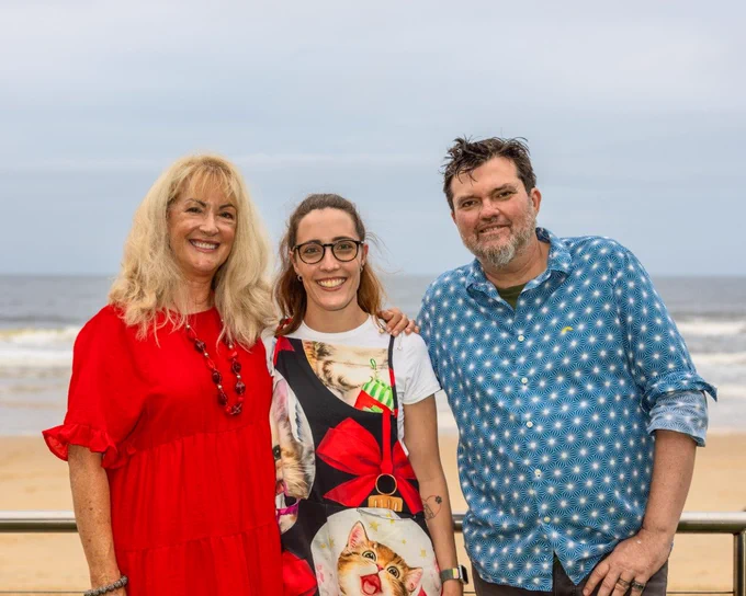 Payge Hollis (centre) with work colleagues Beth Hawes and Matthew Armstrong from Inclusion Australia member organisation, Parent 2 Parent.