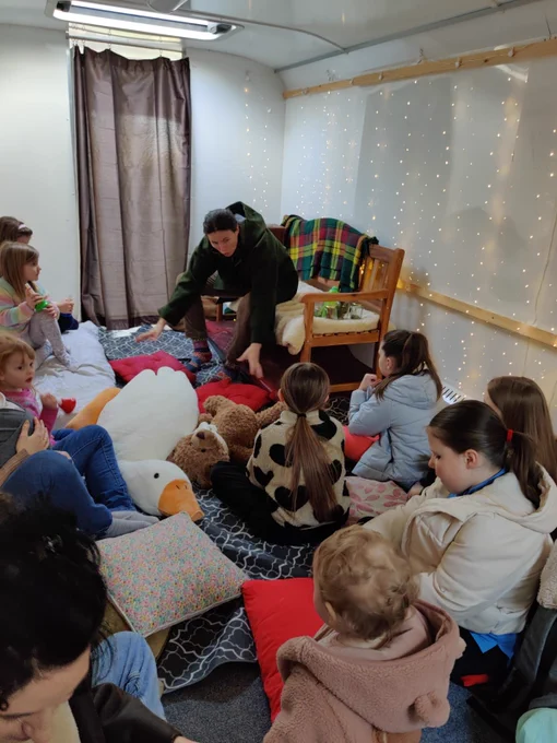 Storytime in the bus. Kids listen on to our interactive storyteller Jessie.