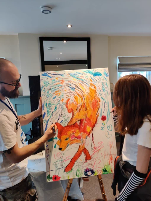 Artist Twiggy gets creative with local creating a collaboration canvas or a fox.