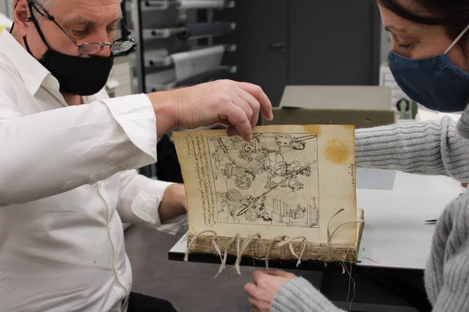 image showing conservator Kiera McKee, Glasgow University, being mentored by experienced conservator in project to conserve the 16th C MS Hunter 242 Historia de Tlaxcala.  