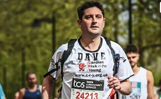 A man jogging in  a park.