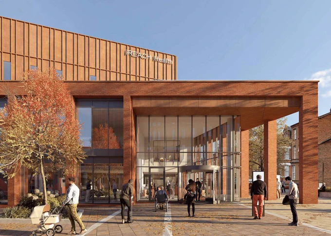 Image shows a mockup of what the iREACH building will look like once completed, from the front on. It features people walking in and out of the building. 