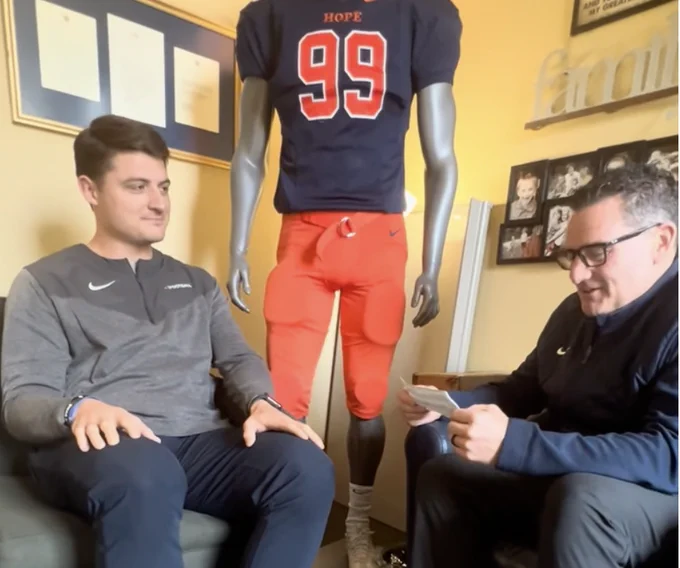 Jacob Pardonnet and Peter Stuursma chat in a Hope College office.
