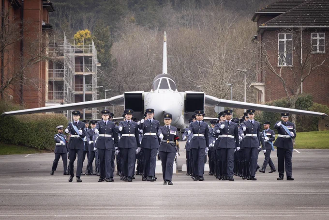 The recruits of Pearson intake marching back on to the parade square in front of a Tornado Fast Jet after completing the parade to signify their completion of the Basic Recruit Training Course and entry in to the Royal Air Force.