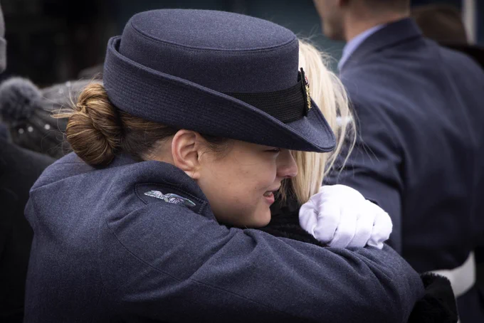 A recruit hugging a loved one following the completion of their graduation parade.