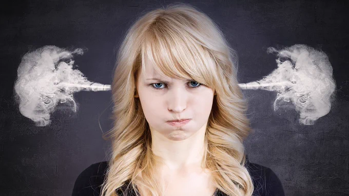 Women looking frustrated with steam coming out of her ears