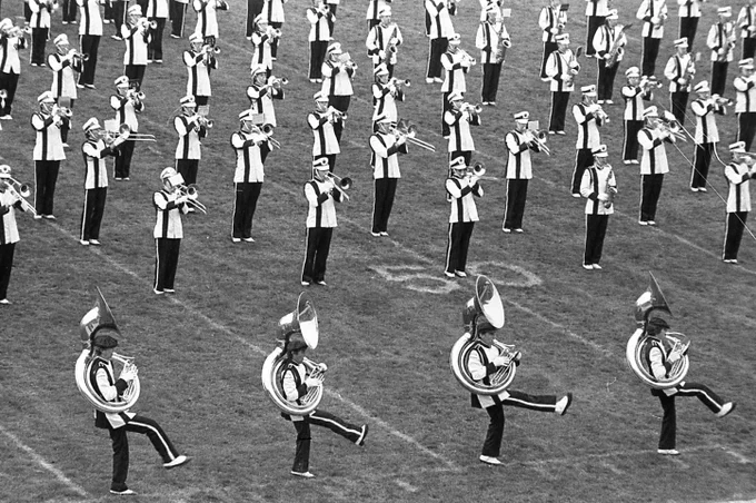 The Marching Virginians performing the Hokie Pokey at halftime in Lane Stadium, 1983.