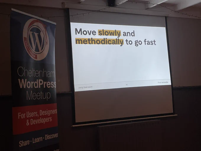 Banner, projector screen showing slide
