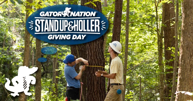 "Gator Nation"
"Stand Up & Holler"
"Giving Day"
Two male students measure the trunk of a tree.