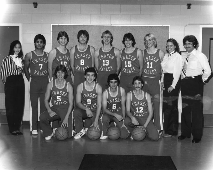 The Fraser Valley College Cascades in the 1980s. The team stands wearing uniforms for a group photo. The image is in black and white.