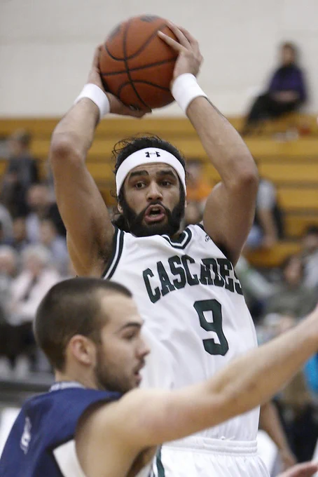 Kyle Grewal jumps with ball in hand at the basketball playoff action vs. Lethbridge in 2012.