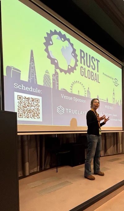 Rebecca Rumbul speaking onstage at Rust Global