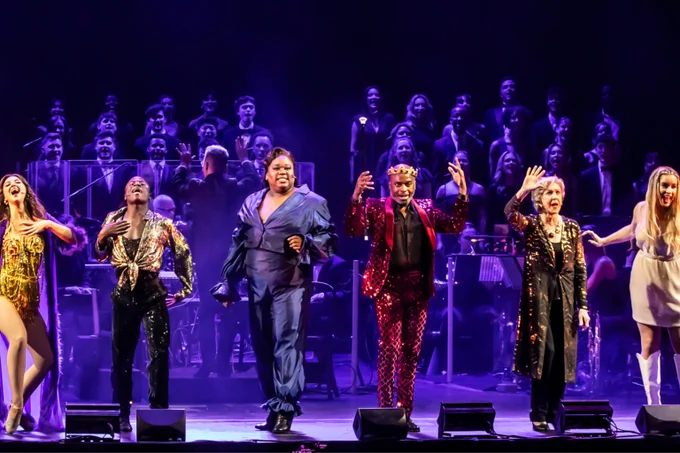 The cast of Pippin perform on stage