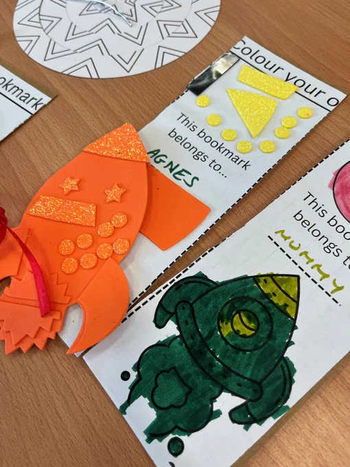 Picture shows bookmarks and  an orange foam rocket.