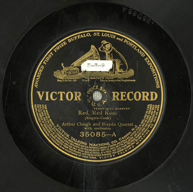 Moderately scratched record label for 'Red, Red Rose', with a worn paper sticker reading 'E-8-9''.