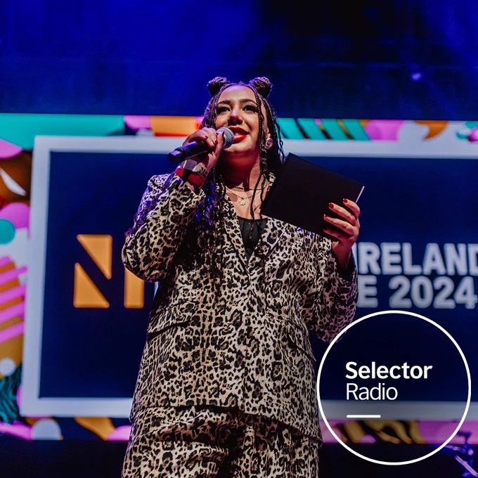 Gemma Bradley presenting on stage at NI Music Prize 2024.