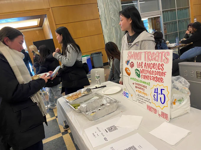 Photo of fundraising table in support of Los Angeles wildfire victims sponsored by the Cornell chapter of Asian Pacific Americans for Action. 