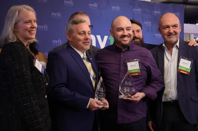 A picture of NOVA IET's Jack Bidlack at the 2025 NVTC Data Center Awards accepting his Community Champion award.