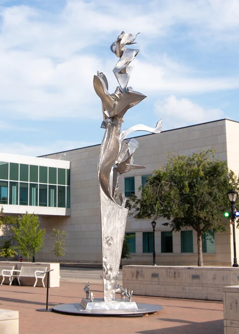 An image of Richard Hunt's "Steel Garden" sculpture on display in front of the ALPLM.
