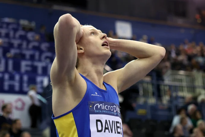 Justin Davies holding his head in disbelief