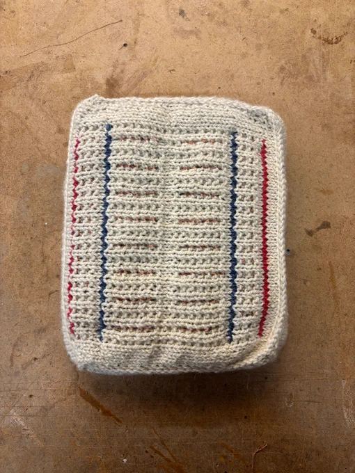 An 8 x 10inch handknitted breadboard with conductive thread