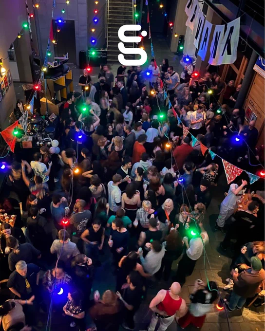 The CCA space is filled with people dancing.