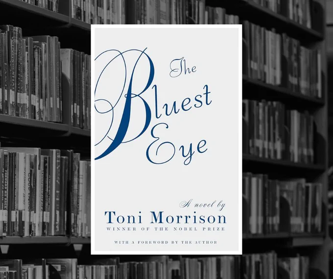Book cover for "The Bluest Eye" by Toni Morrison over a black and white photo of bookshelves in the library.