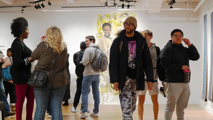 Students enjoy interdisciplinary artist Sabrina Nelson's exhibition on the life and teachings of James Baldwin in the Ruth S. Harley University Center Gallery.