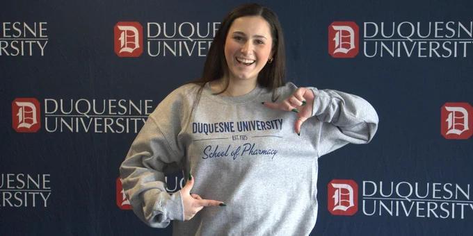 Prospective student celebrating her acceptance into the School of Pharmacy.