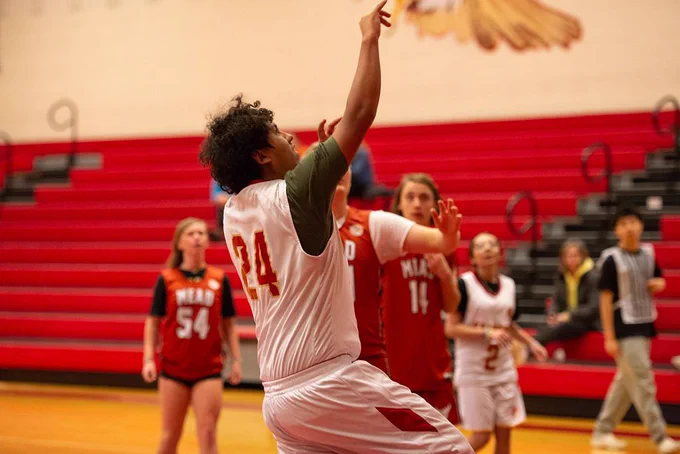 Skyline High unified player shoots the basketball