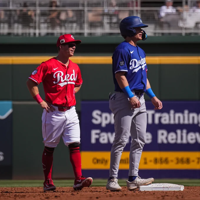 Brothers Matt and Sean McLain have a conversation at 2nd base. 