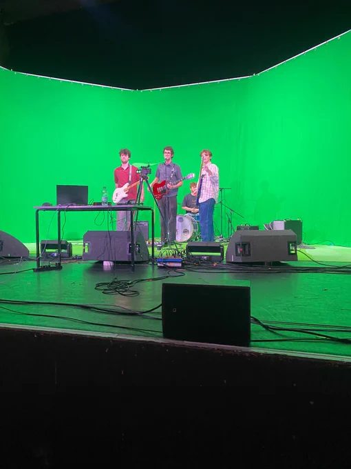 Hungry getting ready to perform in front of a green screen