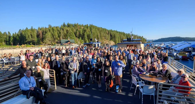 Photo depicting attendees of the Shiftwork2019 Symposium out on the lake at The Coeur d'Alene Resort, in Idaho, USA.