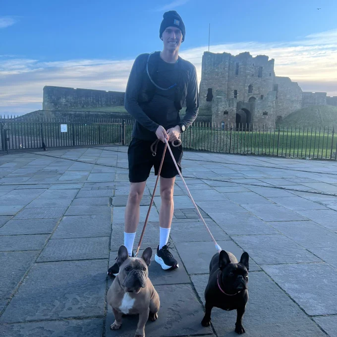 Leodhais out for a run with his two French Bulldogs.