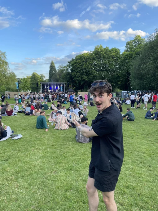 Image of a student smiling at the camera at the Vale during Valefest.