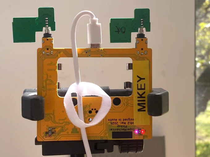 Distance sensor boards in a Pickup on a tripod, being tested against a wall.