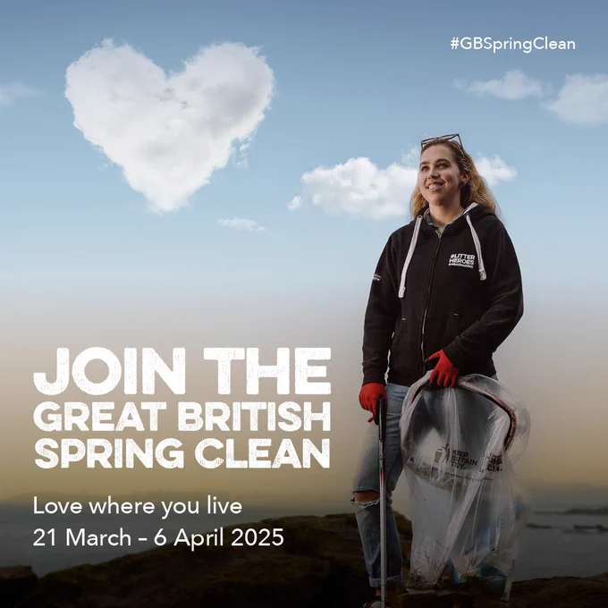 Young lady with long hair stood with a litter pick and hoop in hand. Blue sky with a white cloud heart.