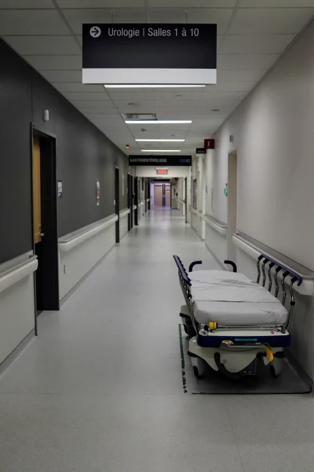 Image depicts an empty hospital corridor with a bed to the right hand side.

Image Credit: Miguel Ausejo via Unsplash https://unsplash.com/photos/white-and-black-hospital-bed-vsSu0oGtLoI