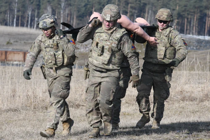U.S. Soldiers move a simulated casualty during the U.S. Army Europe and Africa International Tank Challenge Feb. 17 in Germany. 