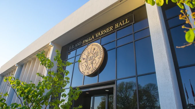 The front entrance of Varner Hall, with the University of Nebraska seal above the doors.