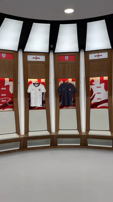 The signed Lionesses home and away shirts are hung up on display in the Wembley dressing rooms.