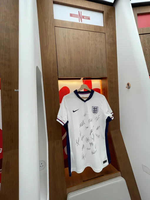 The signed Lionesses home shirt is hung up on display in the dressing rooms.