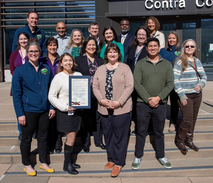 Public information officers hold a proclamation honoring Government Communicators Day in front of the Contra Costa County Administration Building in Martinez, California on Tuesday, February 25, 2025.