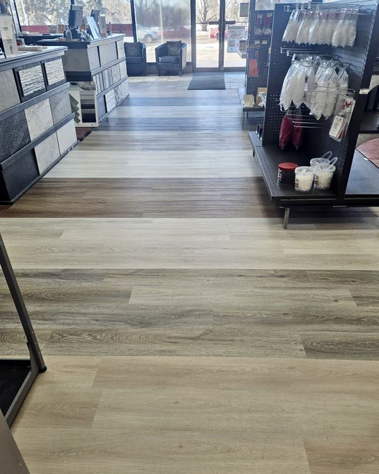 Tile Store Showroom Floor with all shades of wood - look SPC vinyl. 
Scratch-resistant, Pet-friendly flooring, DIY home improvement, renovation flooring best, affordable Affordable flooring option, trends, Interior design inspiration, glowup #YEG #YEGHomes #EdmontonLiving #ProudlyCanadian 