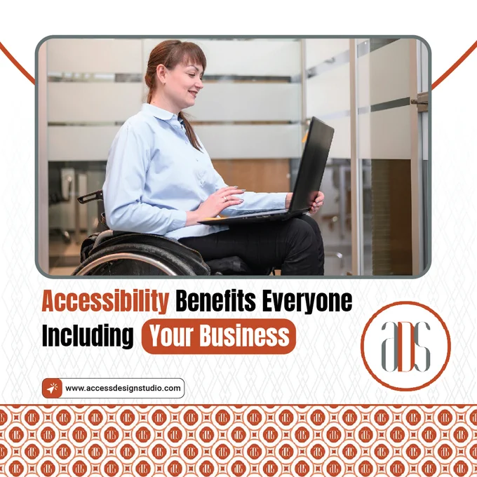 A girl is sitting in a wheelchair and working on her laptop.