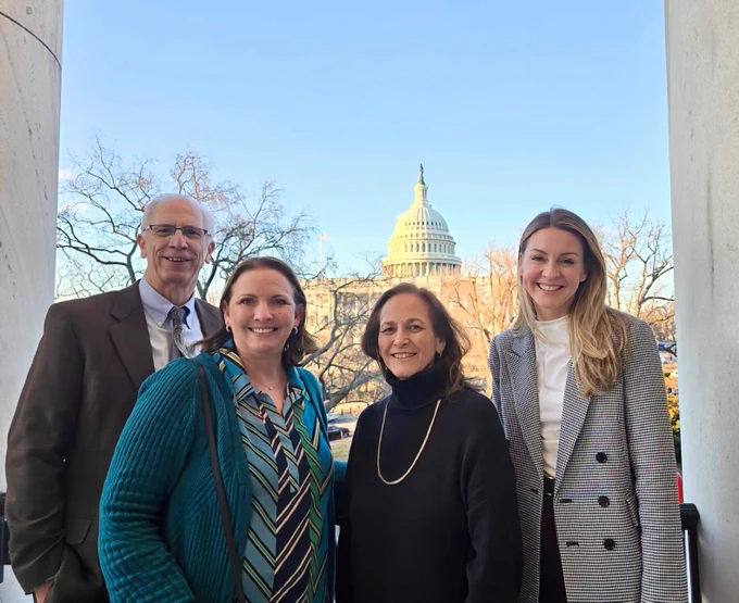 Associate Dean Schmitt, Julie Tesch, Dean Durgan and Whitney Place in front of the U.S. Capitol