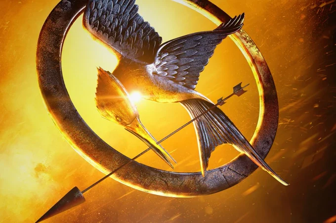 A photo showing a bird pin and an arrow on a fiery background